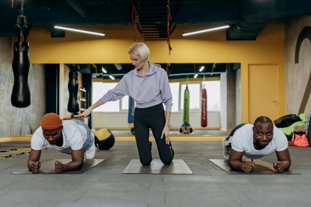 Two men doing a plank